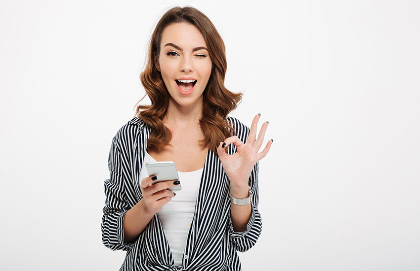 Casual Girl Holding Mobile Phone