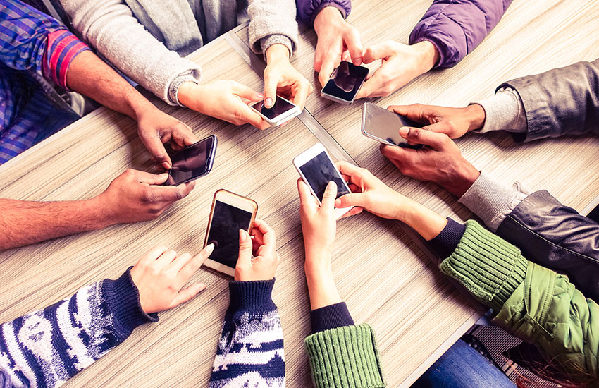 Hands Circle Using Phone in Cafe