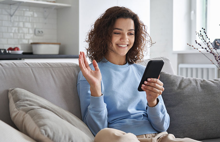 Happy Hispanic Teen Girl Waving Hand