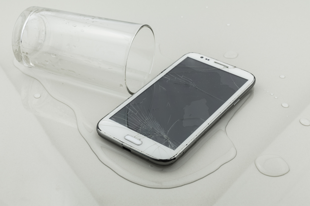 smartphone with water damage from spilt glass